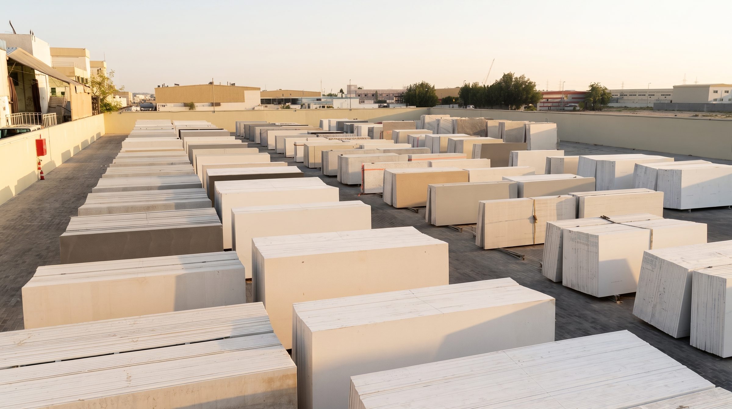 Bundled quartz slabs staged for dispatch in the Al Mina Marble yard, Sharjah