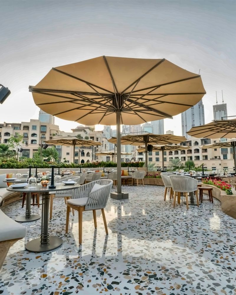 Terrazzo terrace flooring at URLA restaurant, Address Downtown, with the Burj Khalifa behind — supplied by Mina Surface