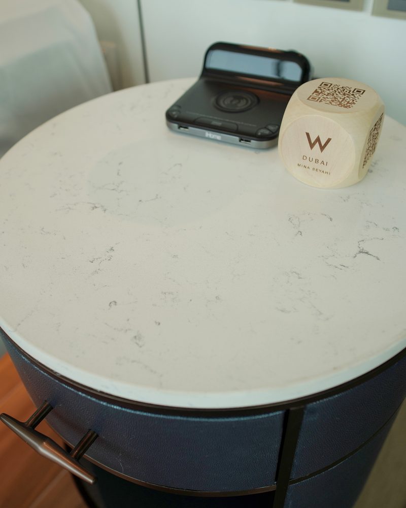 Guest room bedside table with a white veined quartz top supplied by Mina Surface, W Dubai — Mina Seyahi